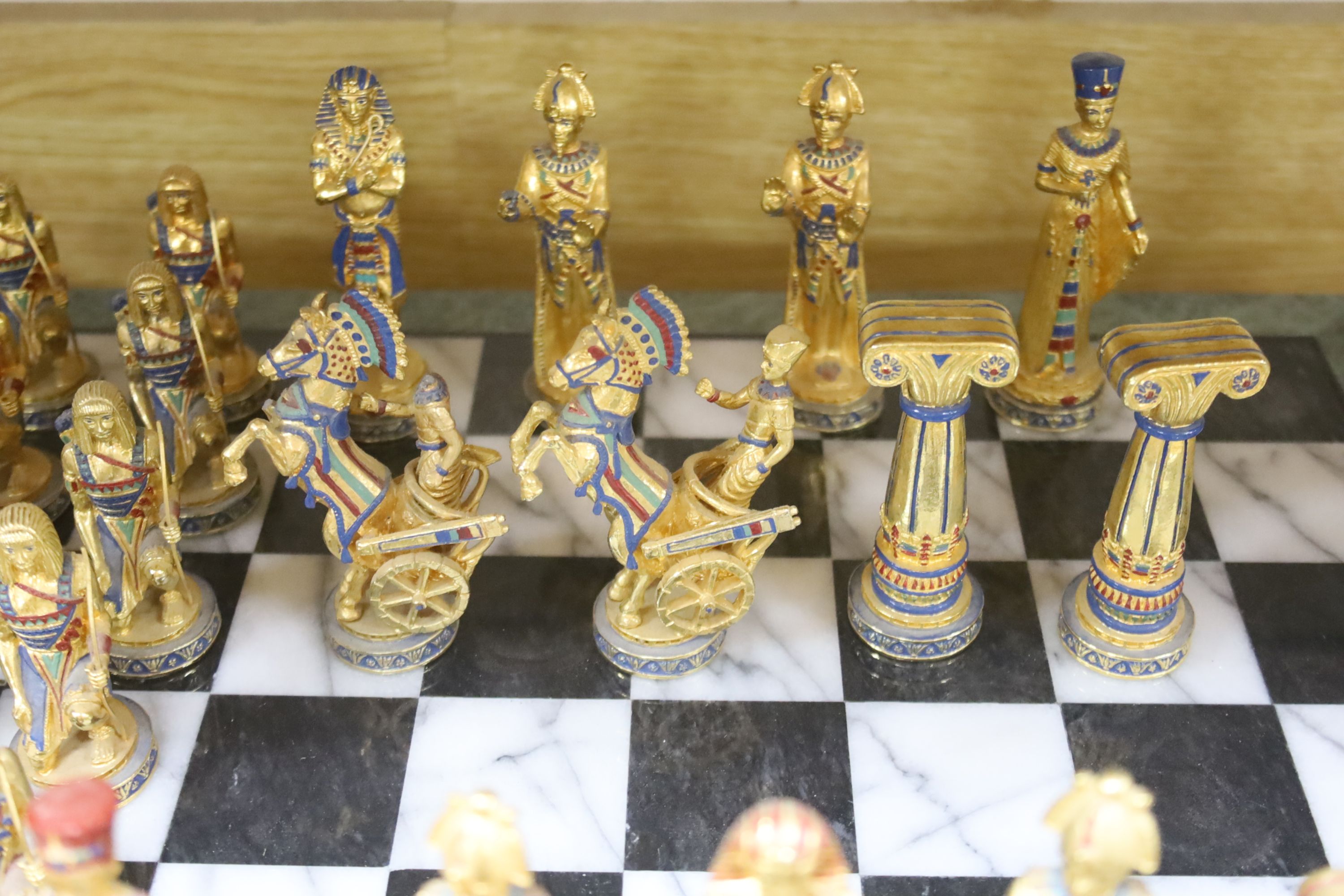 A contemporary chess board and pieces, Egyptian theme